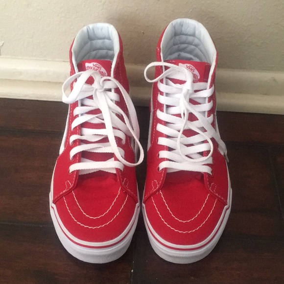 red high top vans on feet